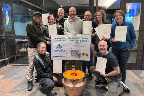 Trekkers receiving certificate from Nepal Pyramids Trekking after the completion of Manaslu Trek