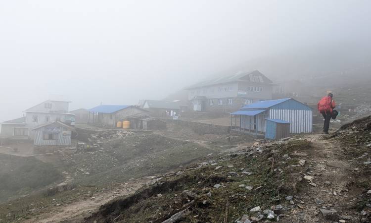 trekker trekking in the region of solu during monsoon season in Nepal
