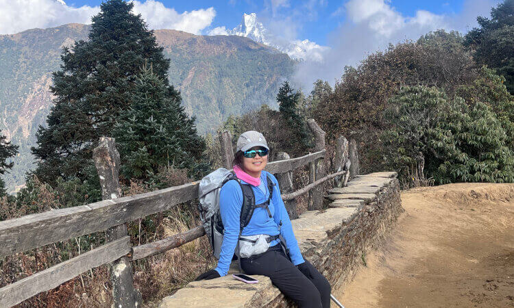 Solo femalte trekker enjoying her break while trekking through the Annapurna region