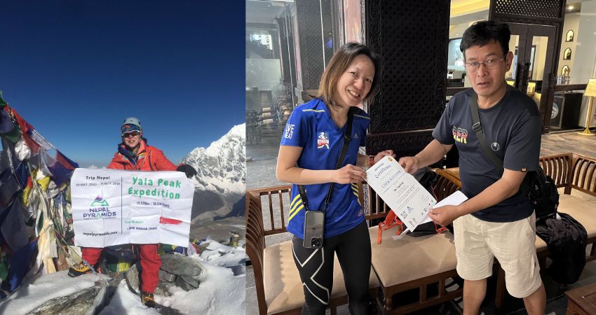 Solo Female Trekker with Nepal Pyramids at the summit of Yala Peak