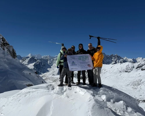 Trekking Group Posing At Chola Pass With Mountains Background